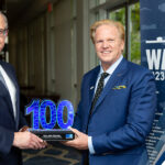 Executive Mosaic’s Jim Garrettson Delivers Booz Allen Hamilton’s Judi Dotson 2023 Wash100 Award