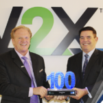 Executive Mosaic’s Jim Garrettson Delivers Booz Allen Hamilton’s Judi Dotson 2023 Wash100 Award