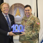 Executive Mosaic’s Jim Garrettson Delivers Booz Allen Hamilton’s Judi Dotson 2023 Wash100 Award