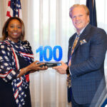 Executive Mosaic’s Jim Garrettson Delivers Booz Allen Hamilton’s Judi Dotson 2023 Wash100 Award