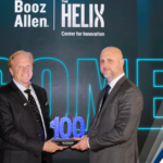 Executive Mosaic’s Jim Garrettson Delivers Booz Allen Hamilton’s Judi Dotson 2023 Wash100 Award